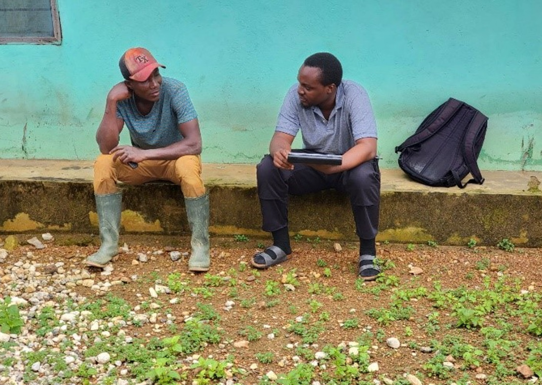 Facilitator from environmental conservation NGO, A Rocha Ghana, interviews a miner in Ghana. Photo. CERSGIS